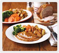 Roast pork with roast potatoes and veg